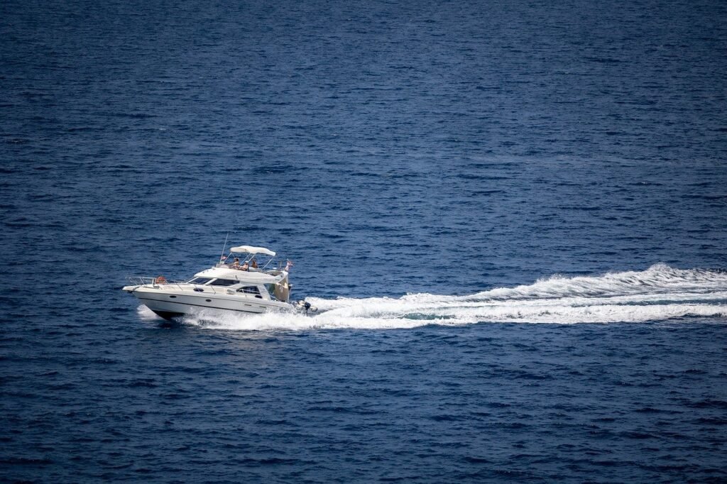 small yacht navigating in the open sea